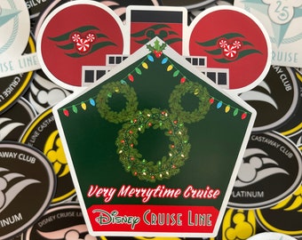 May include: A green and red Christmas-themed sticker featuring a Mickey Mouse head with a wreath and the text "Very Merrytime Cruise" and "Disney Cruise Line".