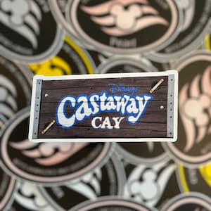 May include: A brown wooden sign with metal accents and the text "Disney Castaway Cay" in blue and white lettering.