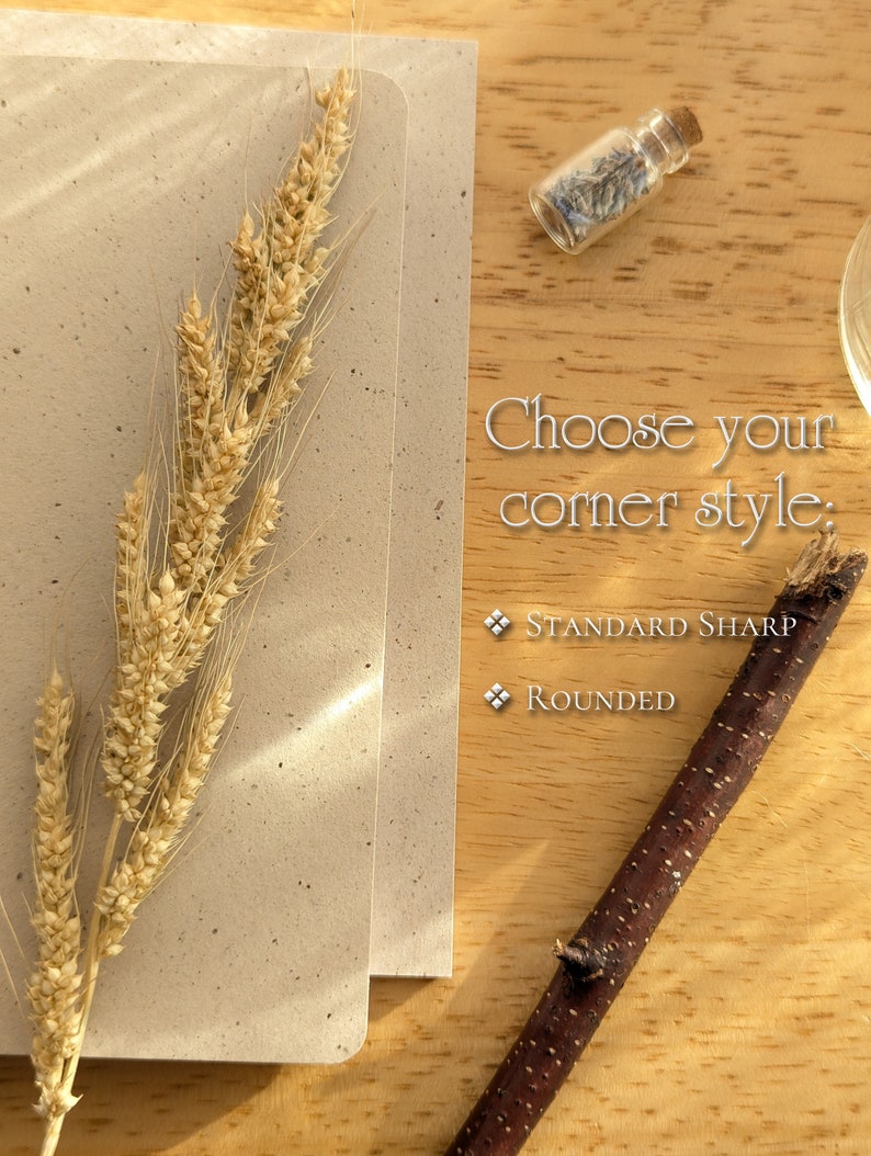 May include: A beige speckled card with a stalk of dried wheat, a small glass vial containing dried lavender, and a dark brown twig. The text reads: Choose your corner style: Standard Sharp, Rounded. The items are arranged on a light wood surface.