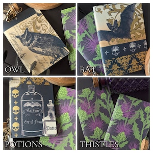 May include: Four notebooks with different designs. One features an owl, another a bat, a third has potion bottles, and the last displays thistles. Each notebook has a unique pattern and the word "OWL", "BAT", "POTIONS", and "THISTLES" are printed on the bottom.