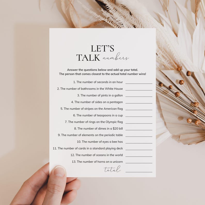 May include: A printable game card with the title "Let's Talk Numbers". The card features a list of 13 questions about numbers, such as "The number of seconds in an hour" and "The number of horns on a unicorn".