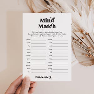 May include: A white card with the words "Mind Match" in a bold, decorative font. The card includes fill-in-the-blank prompts like "happy," "family," and "fun." The text "Total correct:" appears at the bottom.