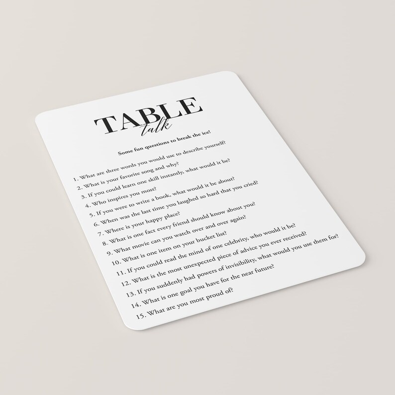 Puede incluir: Tarjeta blanca con texto negro, titulada "Table Talk". La tarjeta presenta 15 preguntas para romper el hielo en una reuni&oacute;n.