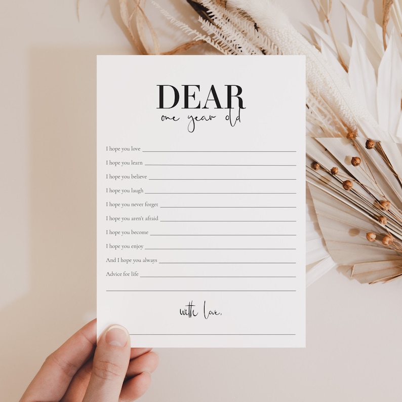 May include: A printable card with the text "DEAR one year old" and a list of things to hope for a child. The card has blank lines for writing in the hopes.