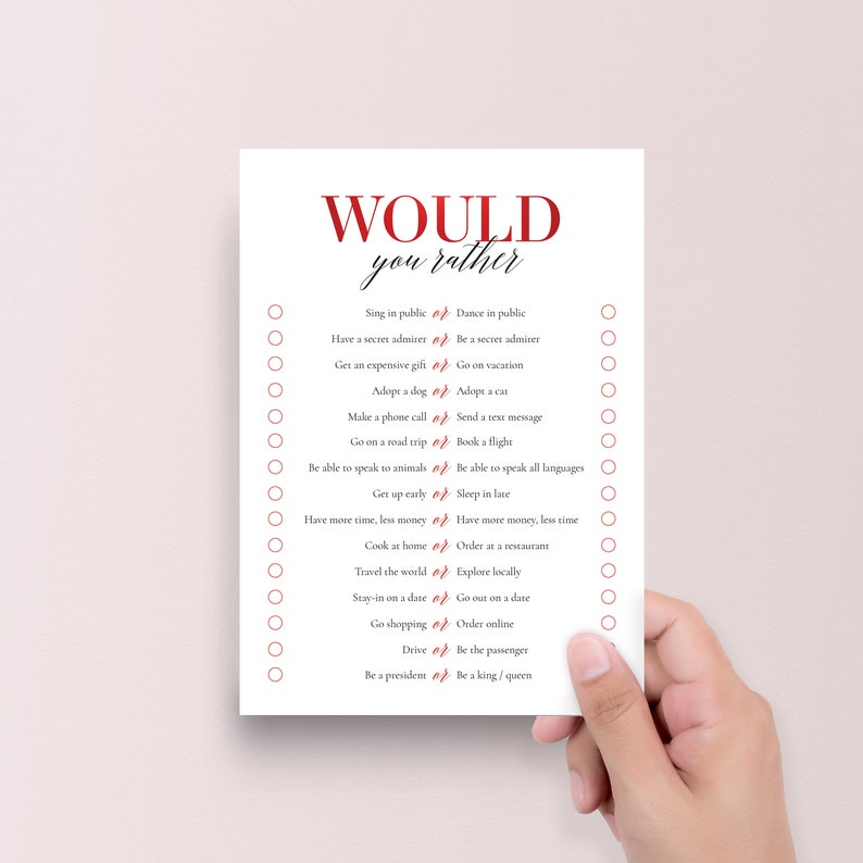 Peut inclure: Une carte de jeu imprimable "Would You Rather" avec 16 questions en texte rouge sur fond blanc. Les questions sont pr&eacute;sent&eacute;es par paires avec un cercle &agrave; c&ocirc;t&eacute; de chaque option.