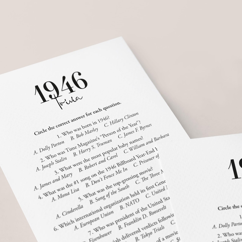 May include: White paper trivia game cards with the year 1946 in large black font. The cards feature trivia questions about the year 1946, including pop culture and historical events. The text "Trivia" is written in a cursive font.