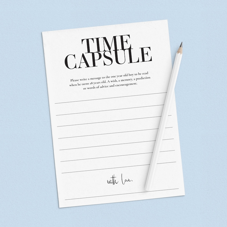 May include: A white card with black text that reads "TIME CAPSULE". The card has lined spaces for writing a message to a one-year-old boy to be read when he turns 18. The card also has the text "with love."