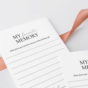 May include: White card with black text that reads "MY favorite MEMORY" and "Write down your favorite memory of the birthday girl."