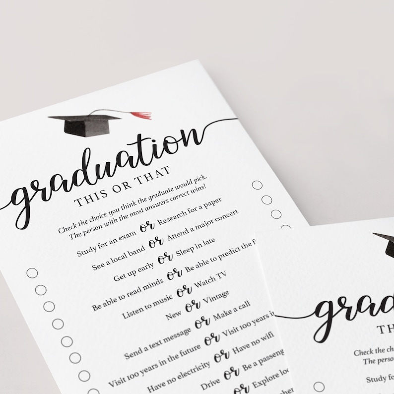 May include: Two white paper sheets with the word "graduation" in elegant script. One sheet features a graduation cap illustration and a "This or That" game with various choices. The other sheet is partially visible.