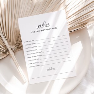 Puede incluir: Una tarjeta imprimible con el texto "wishes for the birthday girl" y una lista de deseos para la cumplea&ntilde;era, incluyendo "I hope you love", "I hope you learn", "I hope you believe", "I hope you laugh", "I hope you never forget", "I hope you aren't afraid", "I hope you become", "I hope you enjoy", y "I hope you always". La tarjeta tambi&eacute;n incluye el texto "with love."