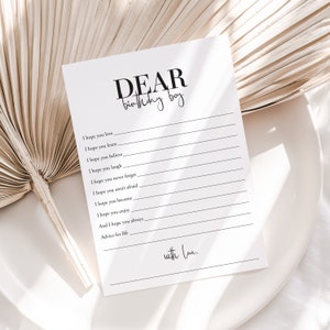May include: A printable card with the text "DEAR birthday boy" at the top. The card has blank lines for writing advice for a birthday boy. The text "with love." is at the bottom of the card.