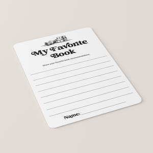 May include: A white card with black text and a drawing of a stack of books. The text reads "My Favorite Book" and "Share your favorite book recommendations." There is a line at the bottom for a name.