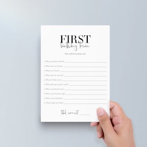 May include: A printable first birthday trivia game with questions about the baby's date of birth, time, location, favourite food, and more. The game has a black and white design with the words "FIRST birthday trivia" at the top.