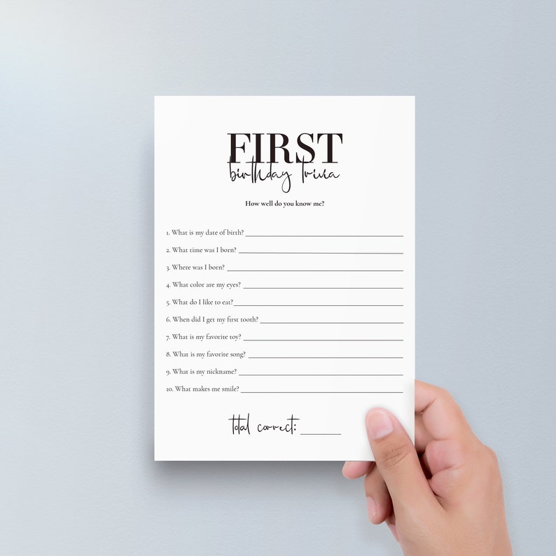 May include: A printable first birthday trivia game with questions about the baby's date of birth, time, location, favourite food, and more. The game has a black and white design with the words "FIRST birthday trivia" at the top.