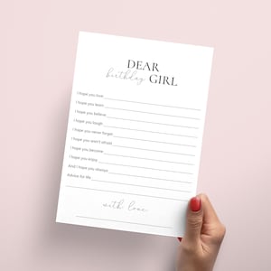 May include: A printable card with the text "DEAR birthday GIRL" and a list of phrases like "I hope you love", "I hope you learn", "I hope you believe", and "I hope you laugh". The card ends with the text "with love."