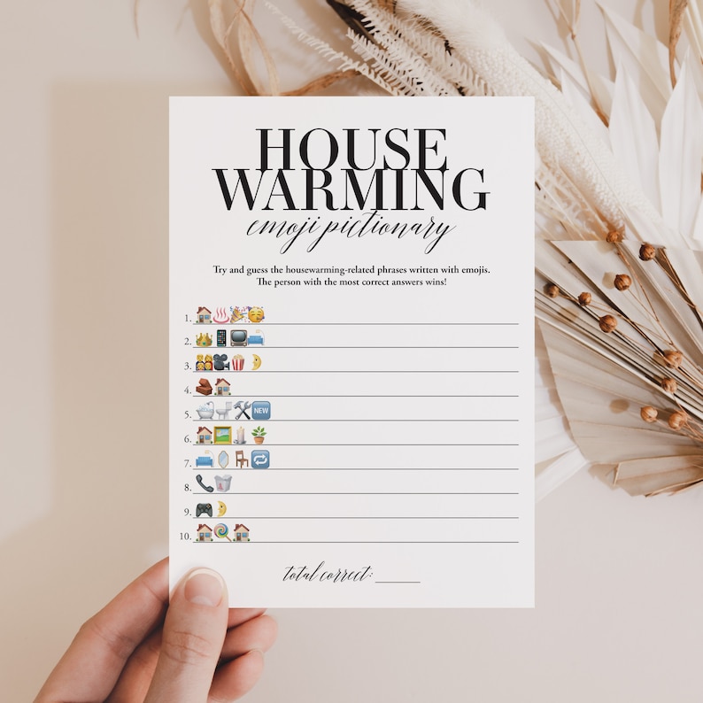 May include: A printable housewarming party game with instructions to guess housewarming-related phrases written with emojis. The game includes 10 emoji phrases and a space to write the total number of correct answers.
