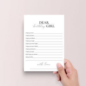 Pode incluir: Um cart&atilde;o imprim&iacute;vel com o texto "DEAR birthday GIRL" no topo. O cart&atilde;o tem uma lista de coisas para escrever para uma menina de anivers&aacute;rio, como "Espero que voc&ecirc; ame", "Espero que voc&ecirc; aprenda", "Espero que voc&ecirc; acredite", "Espero que voc&ecirc; ria", "Espero que voc&ecirc; nunca esque&ccedil;a", "Espero que voc&ecirc; n&atilde;o tenha medo", "Espero que voc&ecirc; se torne", "Espero que voc&ecirc; goste", "E espero que voc&ecirc; sempre", "Conselhos para a vida", e "com amor."