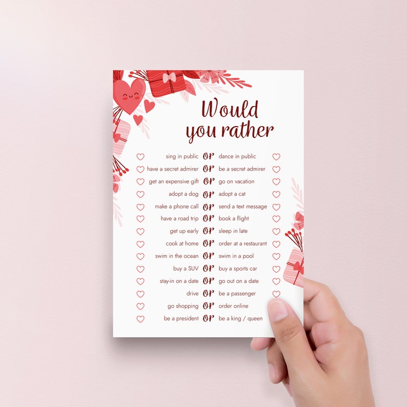 Peut inclure: Une carte de jeu imprimable pour la Saint-Valentin avec le texte "Would you rather" et une liste de 14 questions avec deux choix chacune. La carte est d&eacute;cor&eacute;e de c&oelig;urs et de bo&icirc;tes cadeaux.