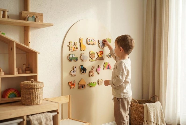 May include: A large arched beige wall-mounted board featuring an array of small, colorful wooden animal and vehicle shapes attached to the surface. The shapes include a giraffe, a zebra, a lion, a bus, a car, and various other figures.