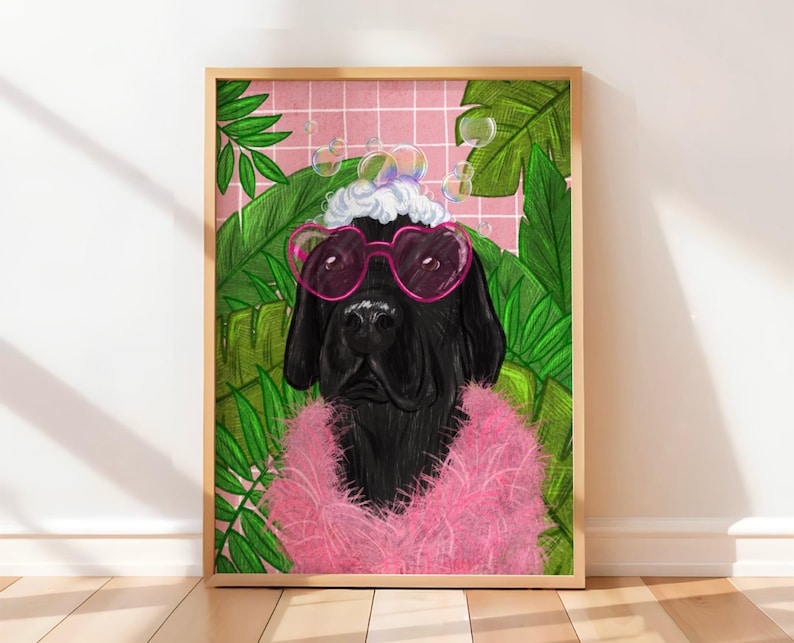 May include: Framed art print of a black dog wearing pink heart-shaped sunglasses and a pink boa. The dog is set against a pink grid background with green tropical leaves and bubbles. The artwork has a fun, whimsical style, perfect for a home.