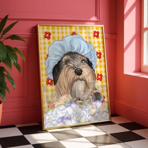 May include: A framed print of a dog wearing a blue shower cap, amidst bubbles. The dog has brown and black fur, set against a yellow and white checked backdrop with red flower details. The artwork is in a gold frame.