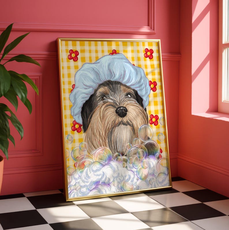 May include: A framed print of a dog wearing a blue shower cap, amidst bubbles. The dog has brown and black fur, set against a yellow and white checked backdrop with red flower details. The artwork is in a gold frame.