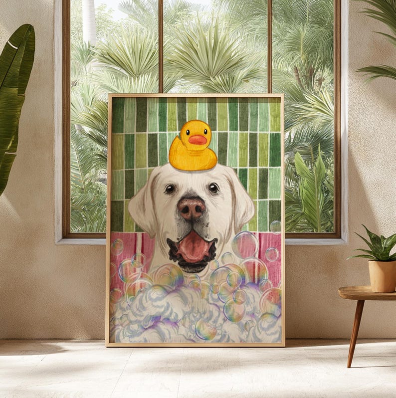 May include: A framed print depicting a white Labrador Retriever with a yellow rubber duck on its head, surrounded by bubbles. The dog has its tongue out, as if in a bath. The background has a green and white striped pattern.