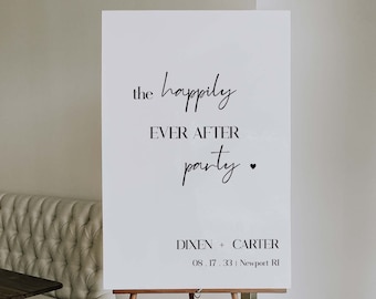 May include: White sign with black text announcing "the happily ever after party" with the date and location: 08.17.33 | Newport RI. The sign is on a wooden easel.