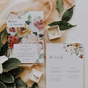 May include: Wedding invitation suite with floral watercolor designs. The invitation card features the names "Robert & Natasha" and details about the wedding ceremony and reception. The second card includes the details of the reception and hotel.