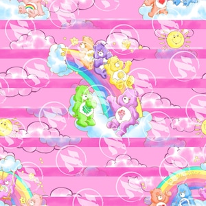 May include: A repeating pattern featuring Care Bears on a pink striped background. The bears are in various colors, including green, purple, yellow, and orange, with rainbows, clouds, and smiling suns. The design has a whimsical, cartoonish style.