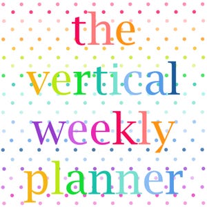 May include: A white planner cover featuring a repeating pattern of small, multicolored polka dots. The text "the vertical weekly planner" is printed in the center in a variety of bright, distinct colors for each letter, including pink, orange, green, and blue.