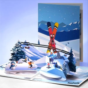 May include: A pop-up greeting card featuring a winter ski resort scene. The card depicts skiers, a snowman, ski lifts, and snow-covered mountains. The background shows a blue sky with falling snow and a pair of skis. The text "PinesFamily" is visible.