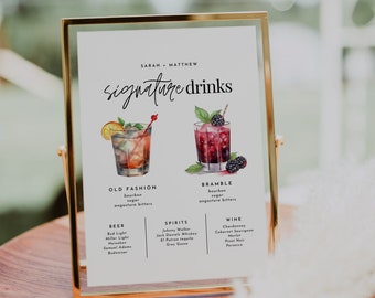 May include: A white sign with gold trim, listing signature drinks for a wedding. The sign features two watercolor illustrations of cocktails, an Old Fashioned and a Bramble, with their ingredients listed below. The sign also lists beer, spirits, and wine options.