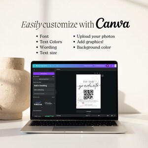 May include: A laptop screen displaying a Canva design template for a graduation tip jar. The design features a marble background with pink flowers and the text "TIP THE GRADUATE". A QR code is also included on the design.