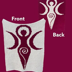 May include: A white knitted throw blanket with a burgundy triple moon goddess symbol on the front and a burgundy background with a white triple moon goddess symbol on the back.