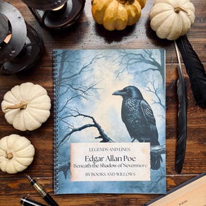 May include: A spiral-bound notebook featuring a black raven perched on a tree branch against a blue sky. The cover text reads: Legends and Lines, Edgar Allan Poe, Beneath the Shadow of Nevermore, by Books and Willows.