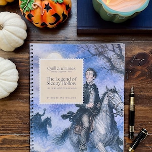 May include: A spiral-bound workbook titled Quill and Lines: The Legend of Sleepy Hollow by Washington Irving. The cover features an illustration of a man riding a horse with a silhouette of a headless horseman in the background.
