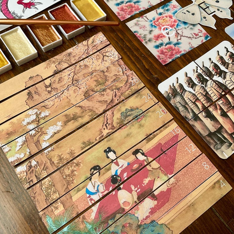 May include: A traditional Chinese painting puzzle with 16 numbered pieces. The puzzle depicts a scene of four women sitting around a table in a garden setting. The painting is on a beige background with a light brown wooden frame.