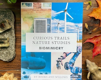 May include: A book cover with a watercolor illustration of a submarine, wind turbines, and a robotic arm. The title is "Curious Trails Nature Studies Biomimicry" and the book is by "Books and Willows".