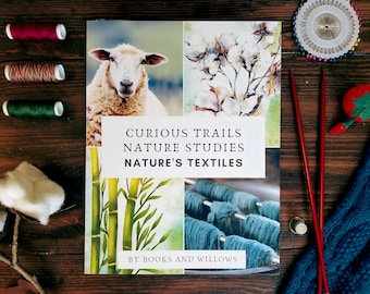 May include: A book titled "Curious Trails Nature Studies Nature's Textiles" by Books and Willows. The cover features four images: a sheep, cotton blossoms, bamboo stalks, and skeins of yarn.
