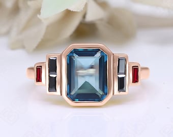 Art Deco London Blue Topaz Ring: Rose Gold Plated Silver, Garnet & Spinal Accents