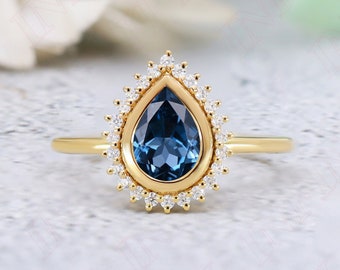 Pear London Blue Topaz Engagement Ring: Sterling Silver, Yellow Gold, Moissanite Accents