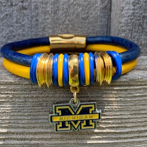 Michigan Wolverines Leather Bracelet: Blue Maize Antique Silver Charm
