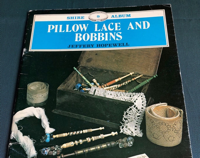 Pillow lace and bobbins by Jeffrey Hopewell