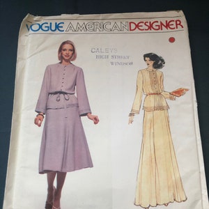 May include: Vintage Vogue American Designer sewing pattern for a dress and skirt set. The pattern is for a high street look by Caleys Windsor and is designed by Albert Nipon. The pattern is from 1983.