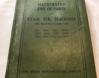 May include: An antique green book titled "ILLUSTRATED LIST OF PARTS" for Class 15K machines. The cover includes the Singer Manufacturing Company logo and a list of machine model numbers. The book is slightly worn.