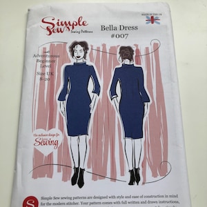 May include: A Simple Sew sewing pattern for the Bella Dress, size UK 8-20. The package shows illustrations of a navy blue dress design. It's labelled as an adventurous beginner level pattern and is made in the UK.