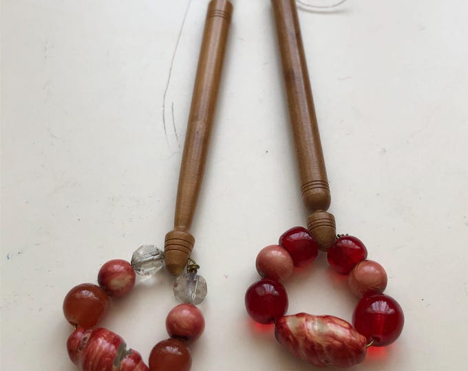 wooden lace bobbins with red spangles