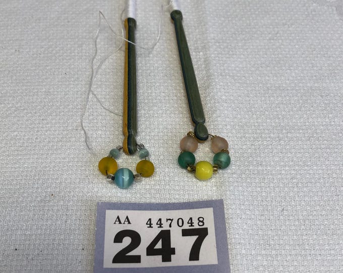 Pair of stripped wooden lacemaking bobbins