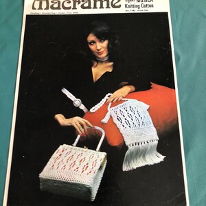 May include: A vintage macrame pattern booklet featuring a woman holding a white and red macrame handbag and a white macrame pouch. The booklet cover features the title "Macrame" and the text "MUSICA Knitting Cotton No. 1182 Price 10p".